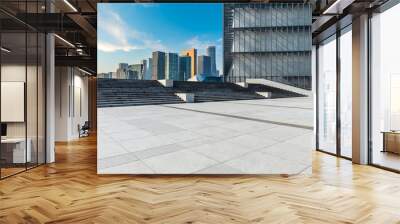 empty square floor and city skyline with modern commercial buildings in hangzhou at sunrise, china. Wall mural