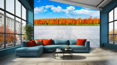 Empty square floor and colorful forest natural landscape in autumn season. Wall mural