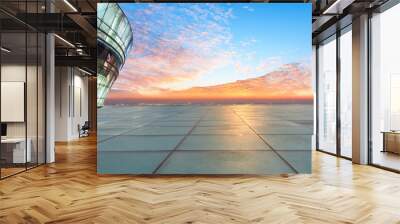 Empty square floor and modern city skyline with buildings at sunset Wall mural