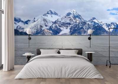 Empty square floor and snow mountain background Wall mural