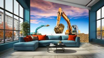 excavator in construction site on sunset sky background Wall mural