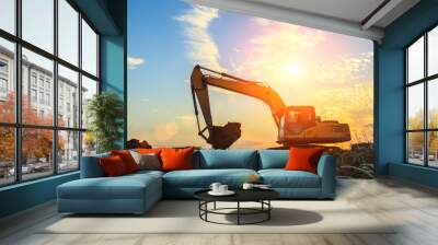 excavator working on construction site and sunrise landscape Wall mural