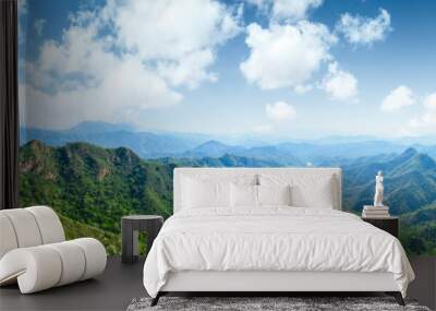 Green mountains and beautiful sky under the blue sky Wall mural