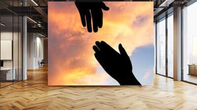 helping hand with the sky sunset background Wall mural