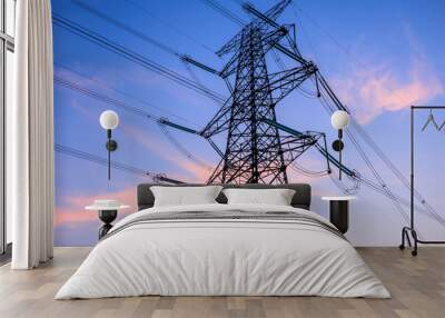 High voltage electric tower at sunset. Transmission power line. Electricity pylons and sky clouds background. Wall mural