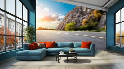 Motion blurred asphalt road and mountain landscape at sunset. Wall mural