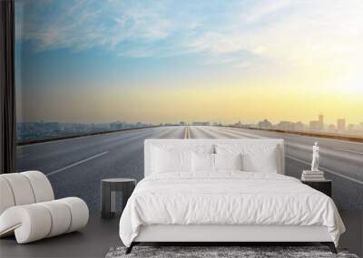 Panoramic city skyline and buildings with empty asphalt road at sunrise Wall mural