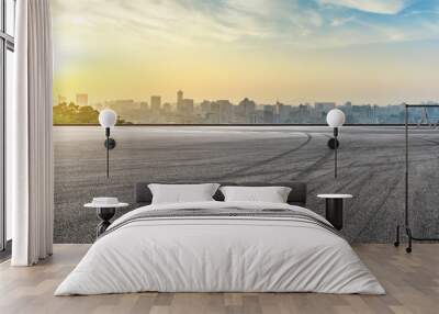 Panoramic city skyline and buildings with empty asphalt road at sunrise Wall mural