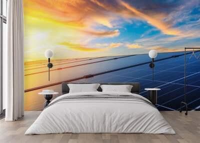 Photovoltaic solar panels on sunset sky background,green clean energy concept. Wall mural