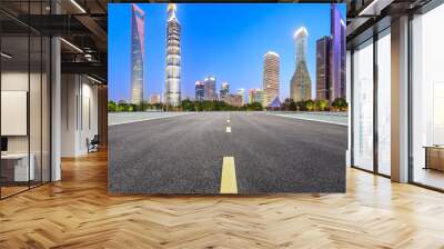 Shanghai modern commercial office buildings and straight asphalt road at night,panoramic view Wall mural