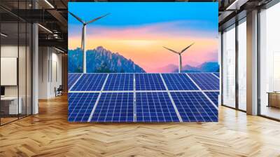 Solar panels with wind turbines in the setting sun,green energy. Wall mural