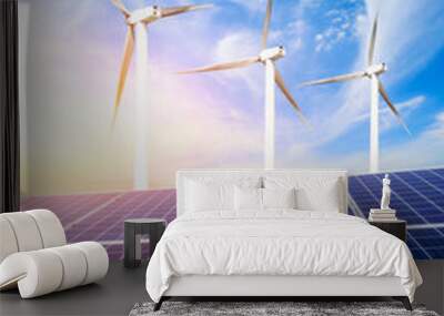 Solar panels with wind turbines on a sunny day,green clean energy concept. Wall mural