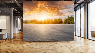 Wide race track and green woods nature landscape at sunset Wall mural