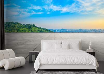 Wide square floor and city skyline with green mountain at sunrise in Hangzhou,China. Wall mural