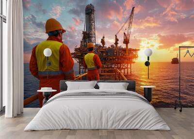 
Offshore Oil Rig at Sunset with Drilling Equipment and Workers in Safety Gear Wall mural