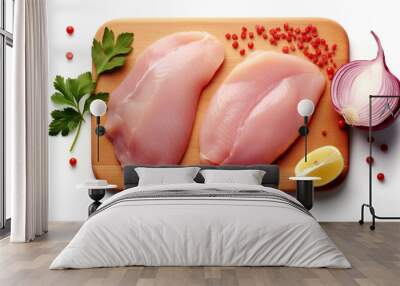 Raw chicken fillet on white background prepared with garlic Wall mural