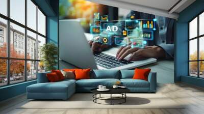 A digital advertising expert is creating an advertising campaign on their laptop. Digital marketing commerce online sale concept Wall mural