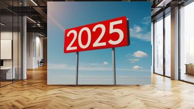 Text 2025 on red sign against blue sky. New Year resolution and goal to change and progress, business success and growth strategy Wall mural