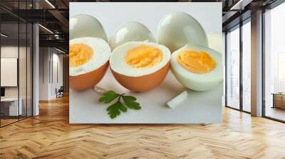 Sliced soft boiled eggs on white background Wall mural