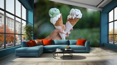 hand holding an ice cream cones Wall mural