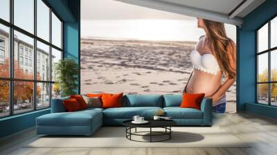 Pregnant woman on the beach Wall mural