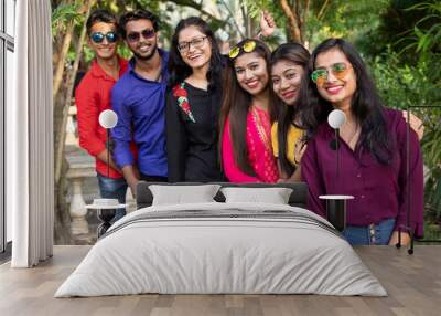 Group of young Indian friends enjoying their company in outdoor location , education, high school and people concept Wall mural