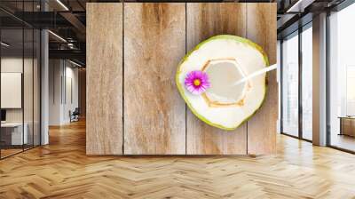 Coconut juice on wooden table with space for text.Top view Wall mural