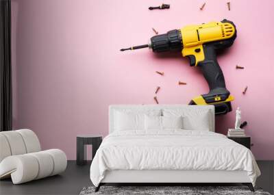 Creative provocation: a yellow screwdriver on a pink background and small screws. Wall mural