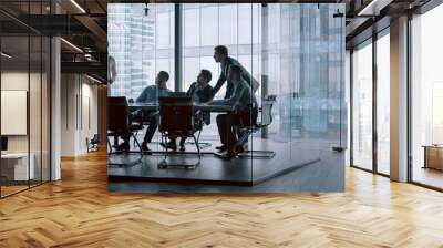 Business people listening the presenter while sitting at desk Wall mural