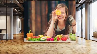 Happy young girl with an orange Wall mural