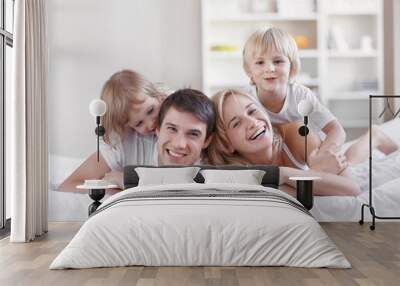 smiling parents with children at home Wall mural