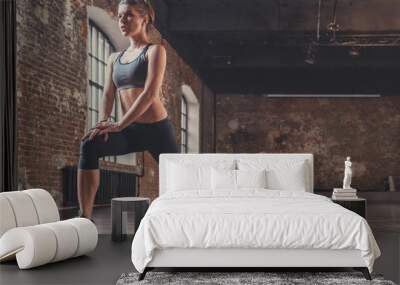 Young athletic girl on training in the loft Wall mural