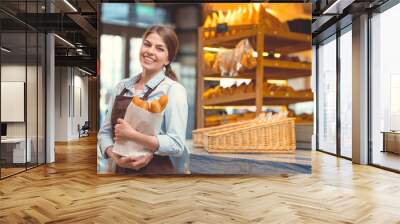 Young baker with baguettes Wall mural