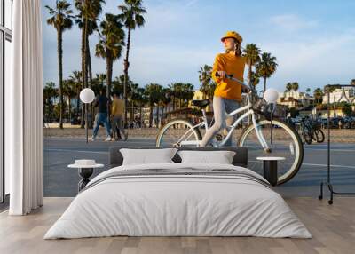 Young girl with bike on Santa Monica Beach Wall mural