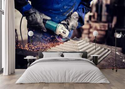 industrial engineer working on cutting a metal and steel bar with angle grinder, metallurgic factory details Wall mural