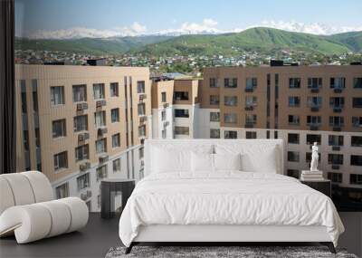 the courtyard of a new multi-storey house with a playground view from the window Wall mural