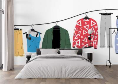 Mens and Womans Clothes on Hanger. Wall mural