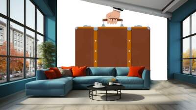 Vintage old travel suitcase in hand Wall mural