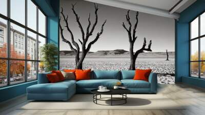 a black and white photo of two dead trees in the desert, generative AI. Wall mural