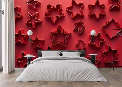 Christmas cookie cutters on red background Wall mural