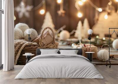 Christmas-themed gift boxes and decorations on a wooden table, with string lights in the background. Wall mural