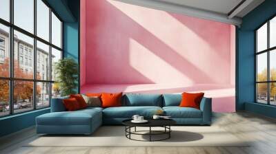 Stunning background image featuring an empty space in pink hues showcasing intriguing light and shadow patterns on the wall and floor ideal for design or creative projects Wall mural