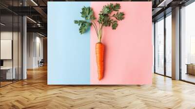 The carrot is orange with green leaves at the top. geneative ai Wall mural