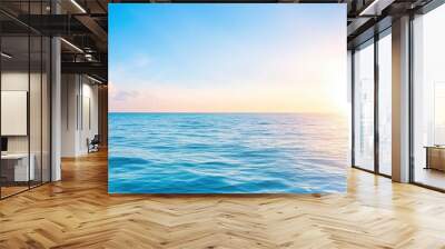 Blue ocean with sun reflection, sun shining on sky background Wall mural