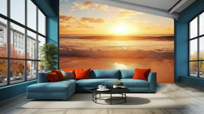 Golden sunshine reflecting on the sand and waves crashing over it during a stunning sunrise over the ocean. Wall mural