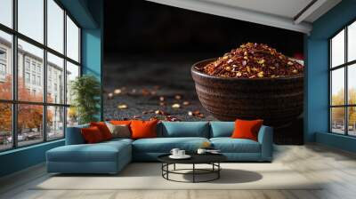 Bowl of chili powder with scattered flakes. Wall mural