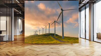 wind turbine in the hill at sunset Wall mural