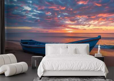 A blue boat is parked on the beach, with sunrise in the background. The sky above has colorful clouds.  Wall mural