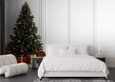 Big beautiful christmas tree decorated with beautiful shiny baubles and many different presents on wooden floor. white wall background with a lot of copy space for text. close up. Wall mural