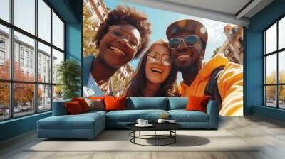 Multi ethnic guys and girls taking selfie outdoors with backlight - happy life style friendship concept on young multicultural people having fun day together in barcelona - bright vivid filter. Wall mural